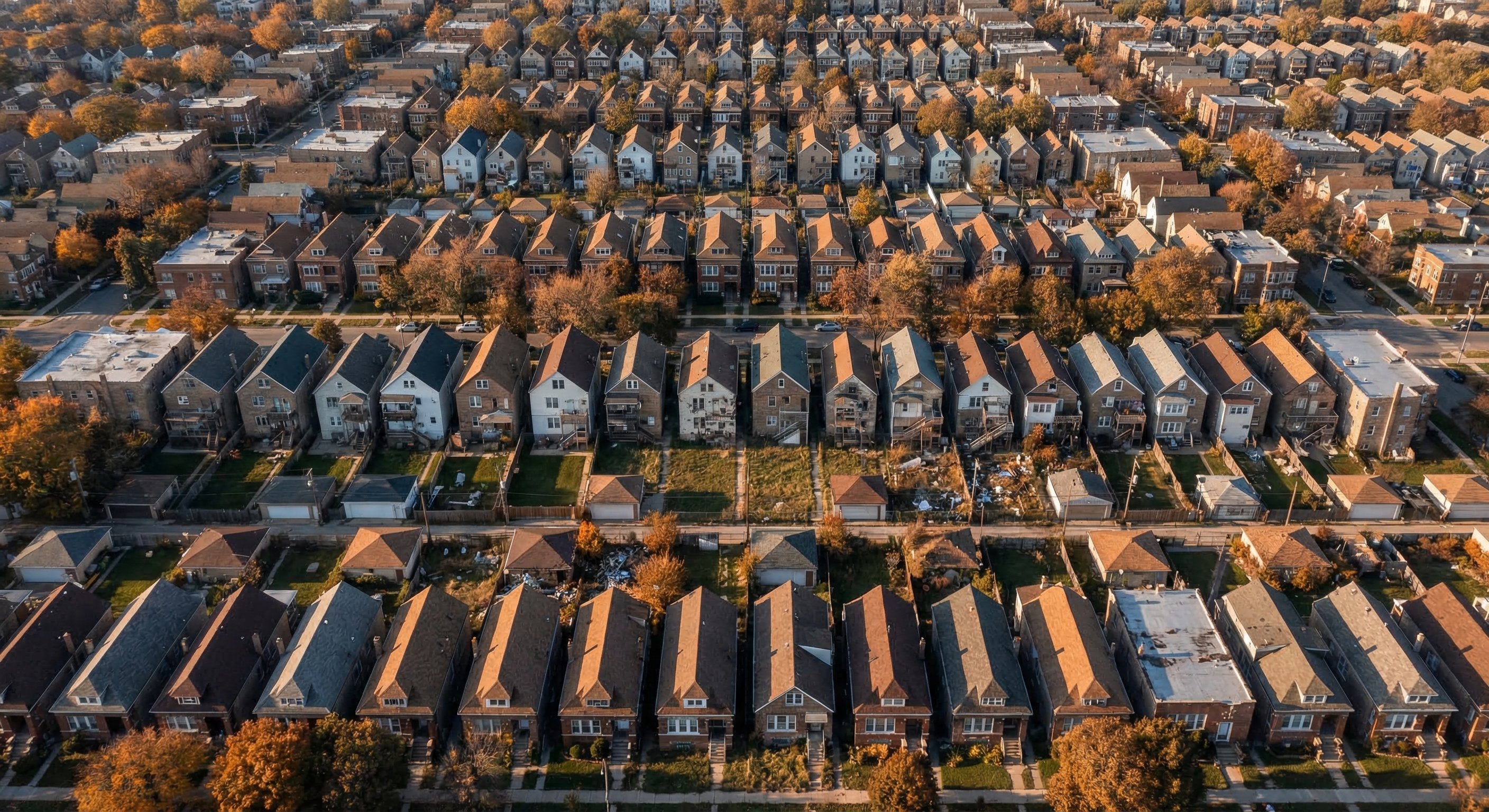Aerial view of Chicago neighborhood grid showing dense urban residential blocks with varying property conditions
