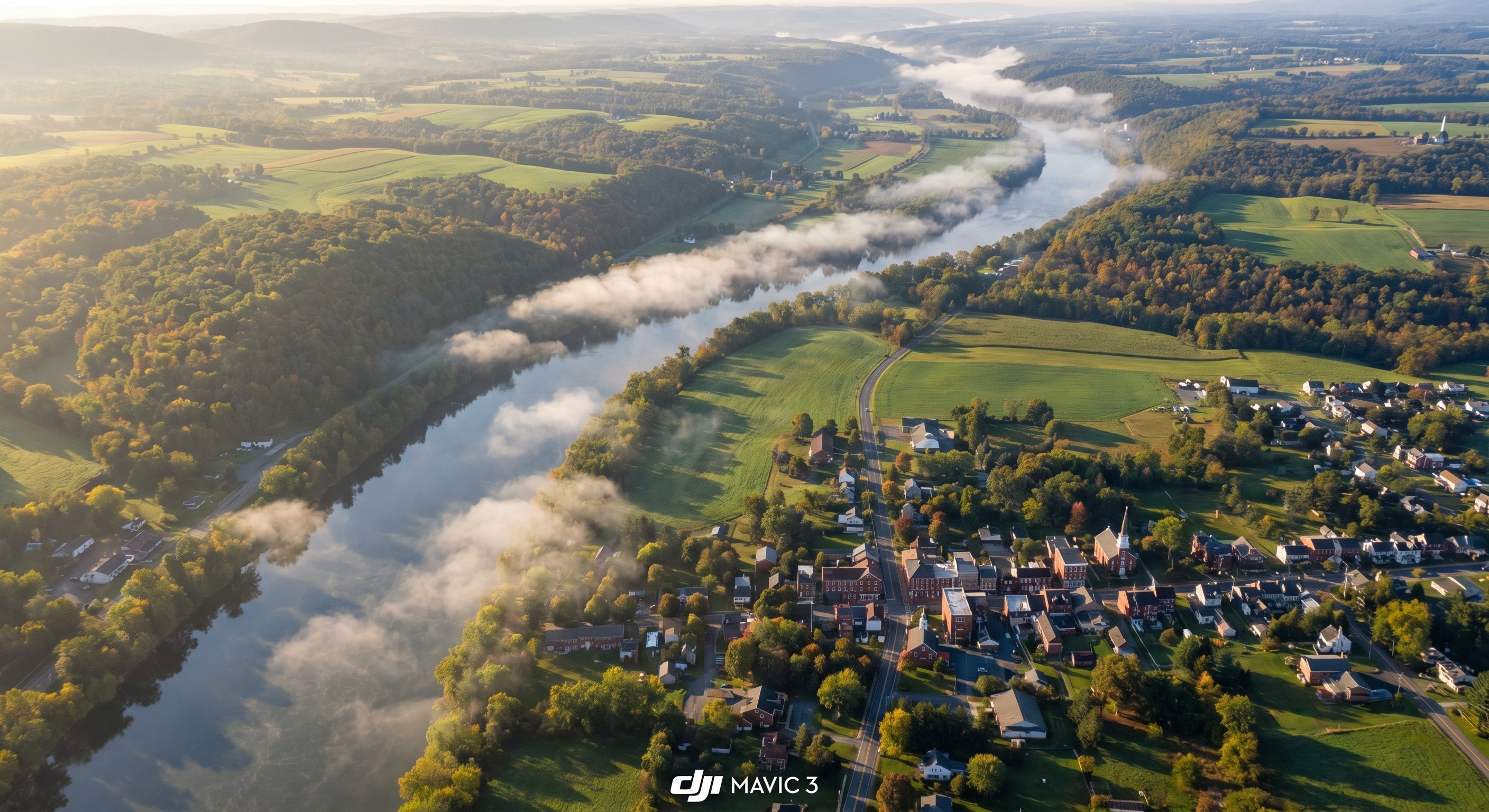 Aerial view of Pennsylvania river valley and towns with rolling hills and farmland