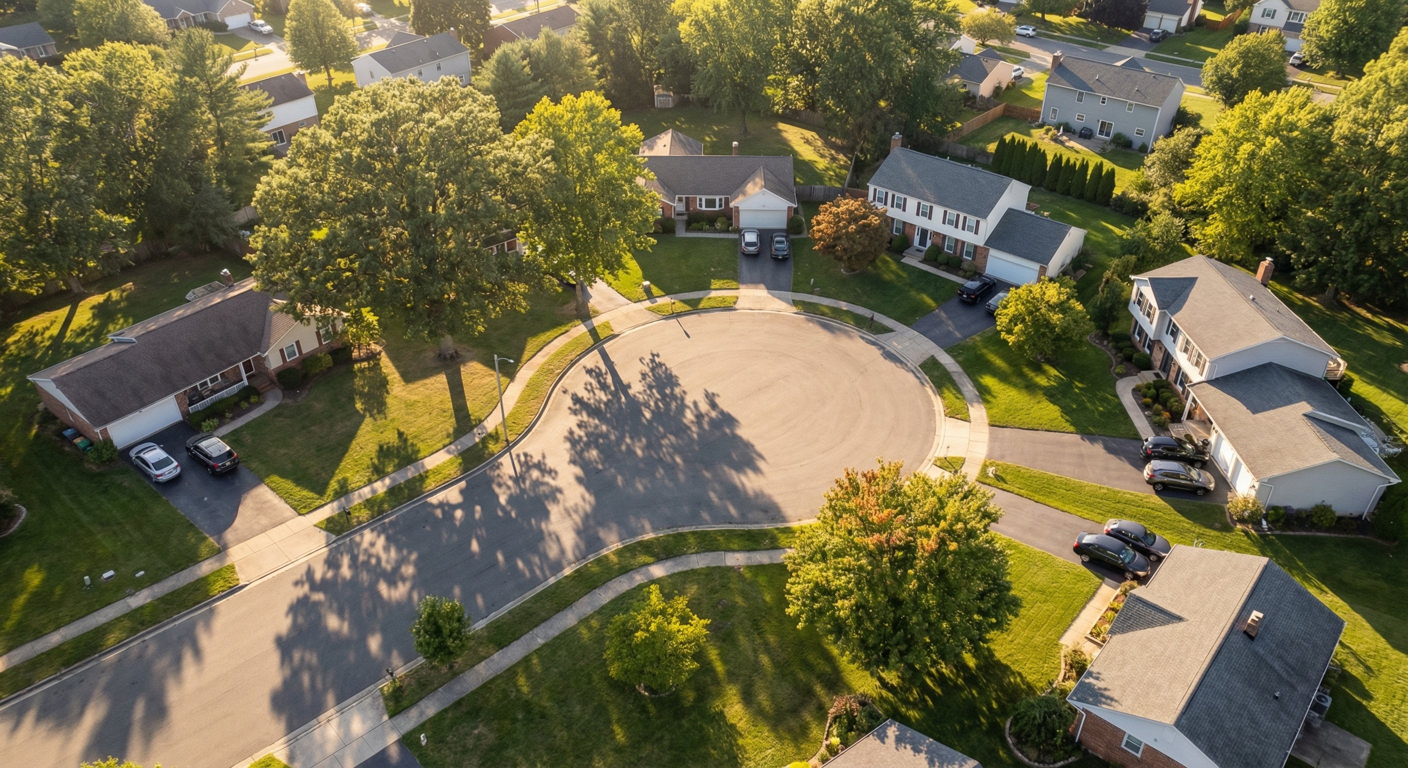 Aerial view of a suburban neighborhood with established homes suitable for rental investment