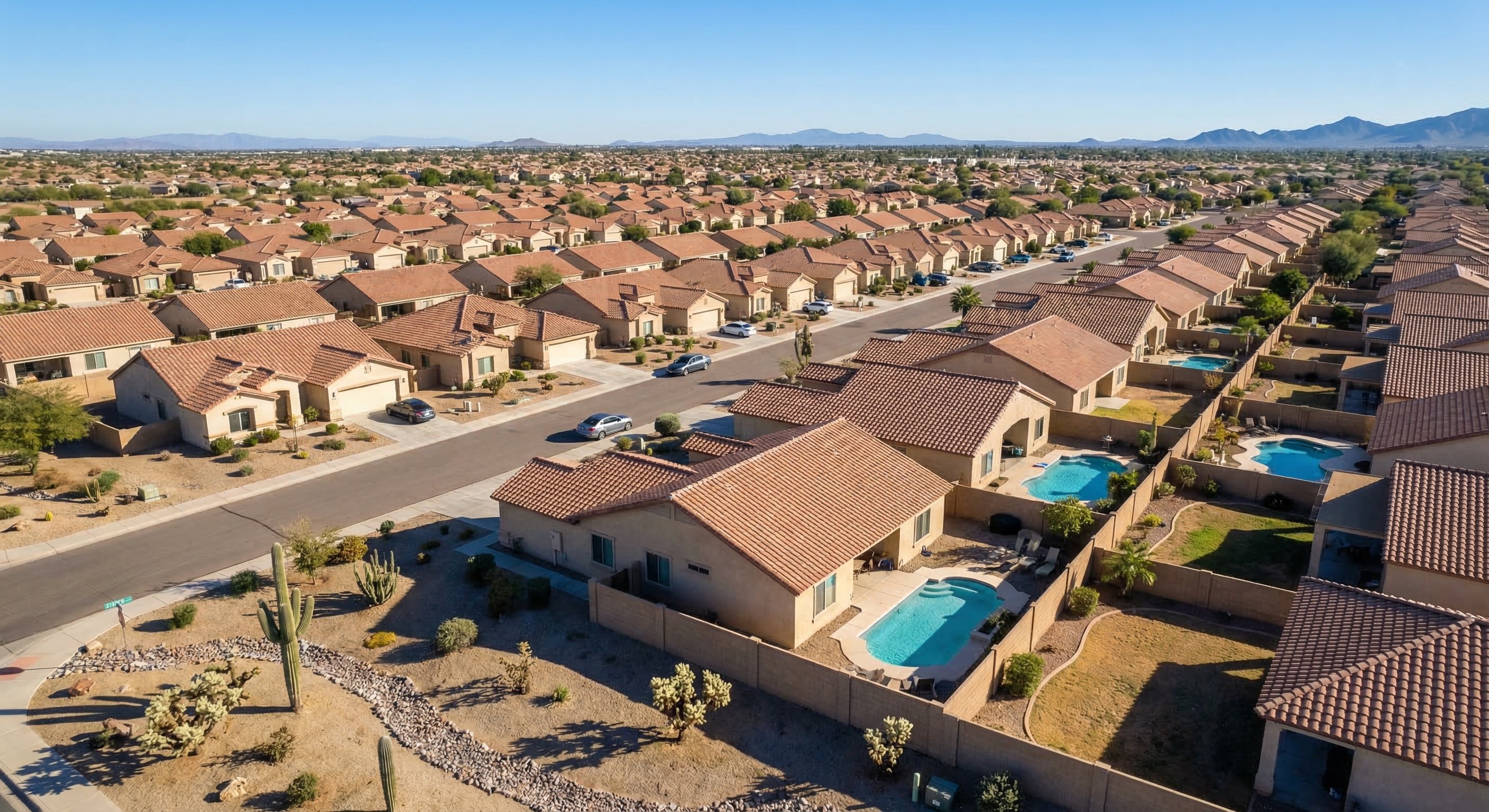 Aerial view of Phoenix, Arizona suburban neighborhood with stucco homes and tile roofs