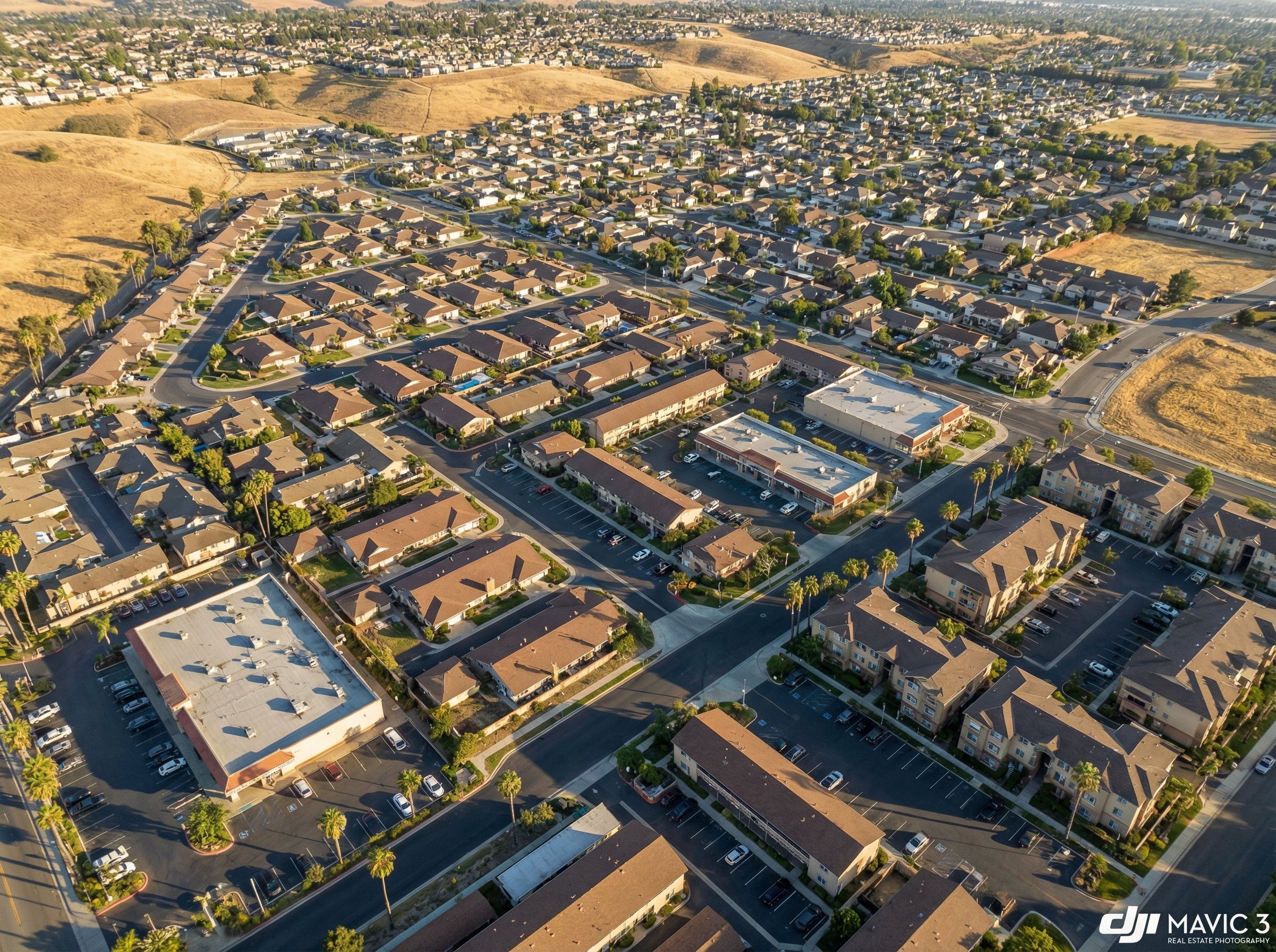 Aerial view of a dense California suburban neighborhood with mixed housing types