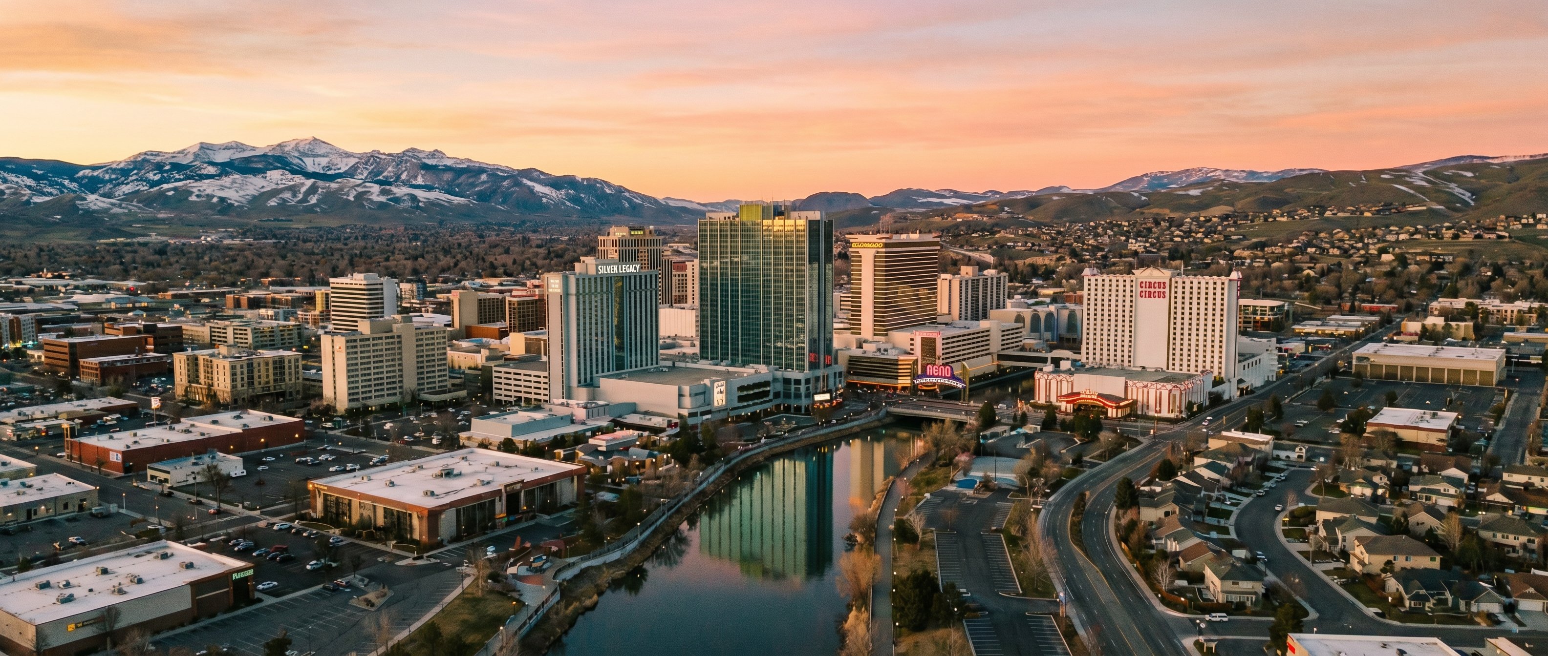 Reno Nevada skyline with Truckee River running through downtown, showing the Washoe County market's distinct character from Las Vegas