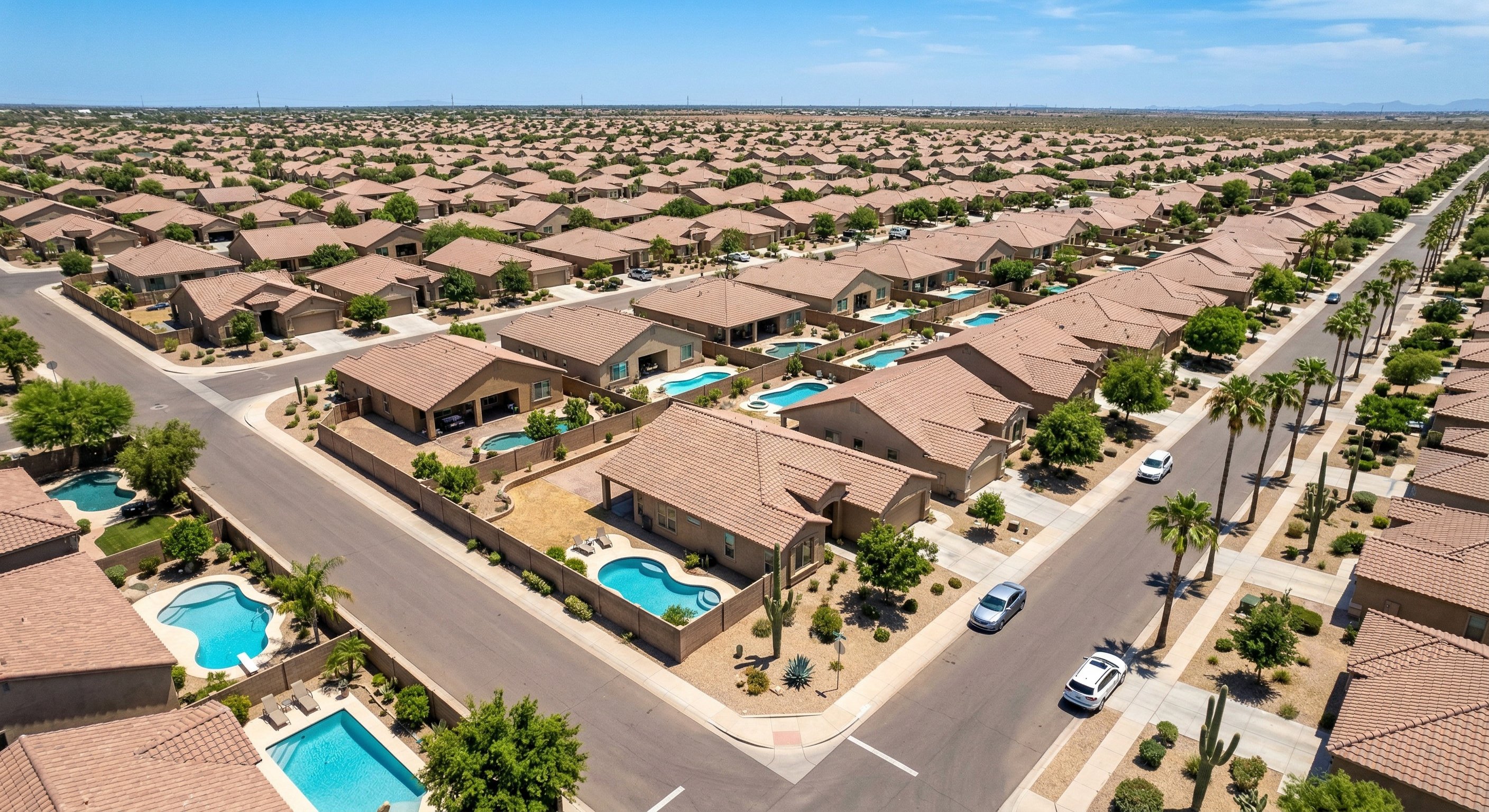 Aerial view of a Phoenix-area residential neighborhood — Maricopa County single-family homes and cul-de-sacs from above
