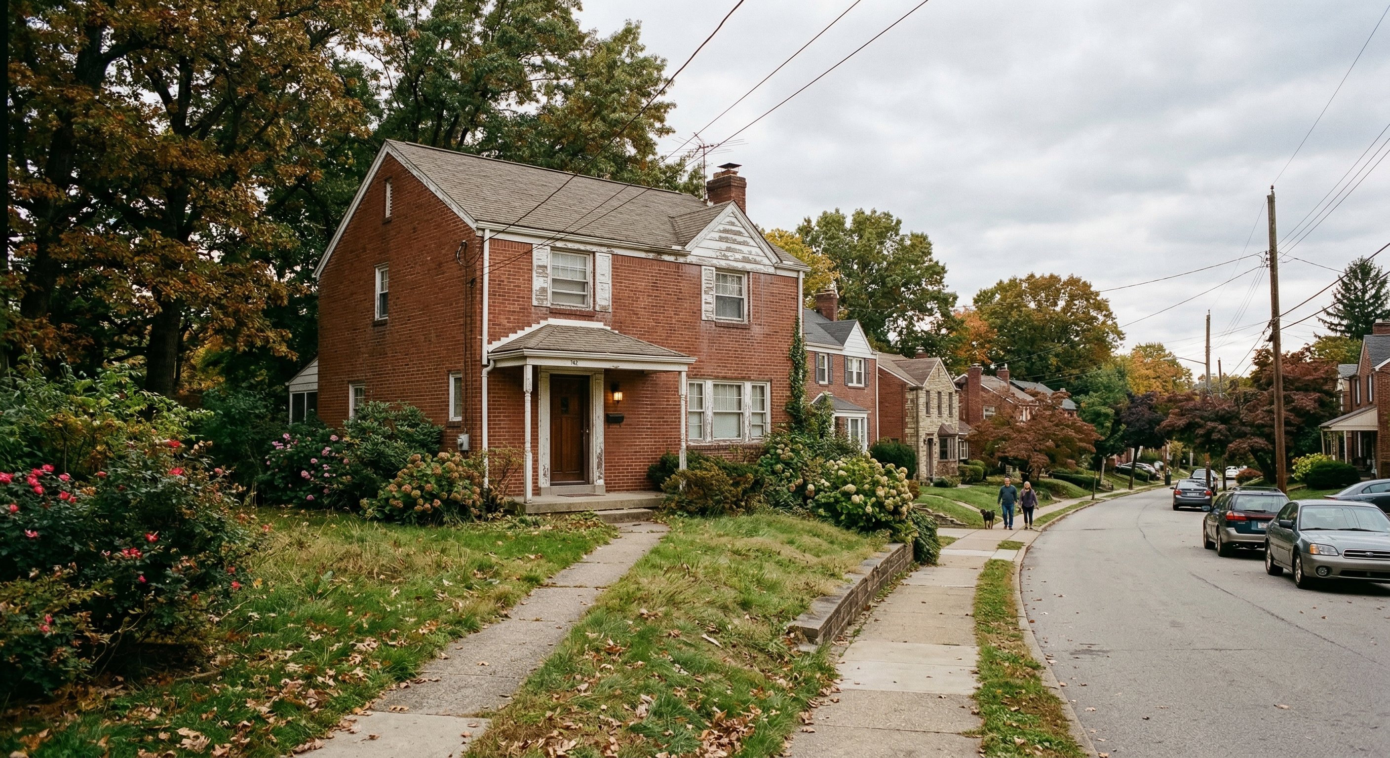 Pittsburgh inner-ring suburb street view showing older brick homes and tree-lined residential street in Allegheny County