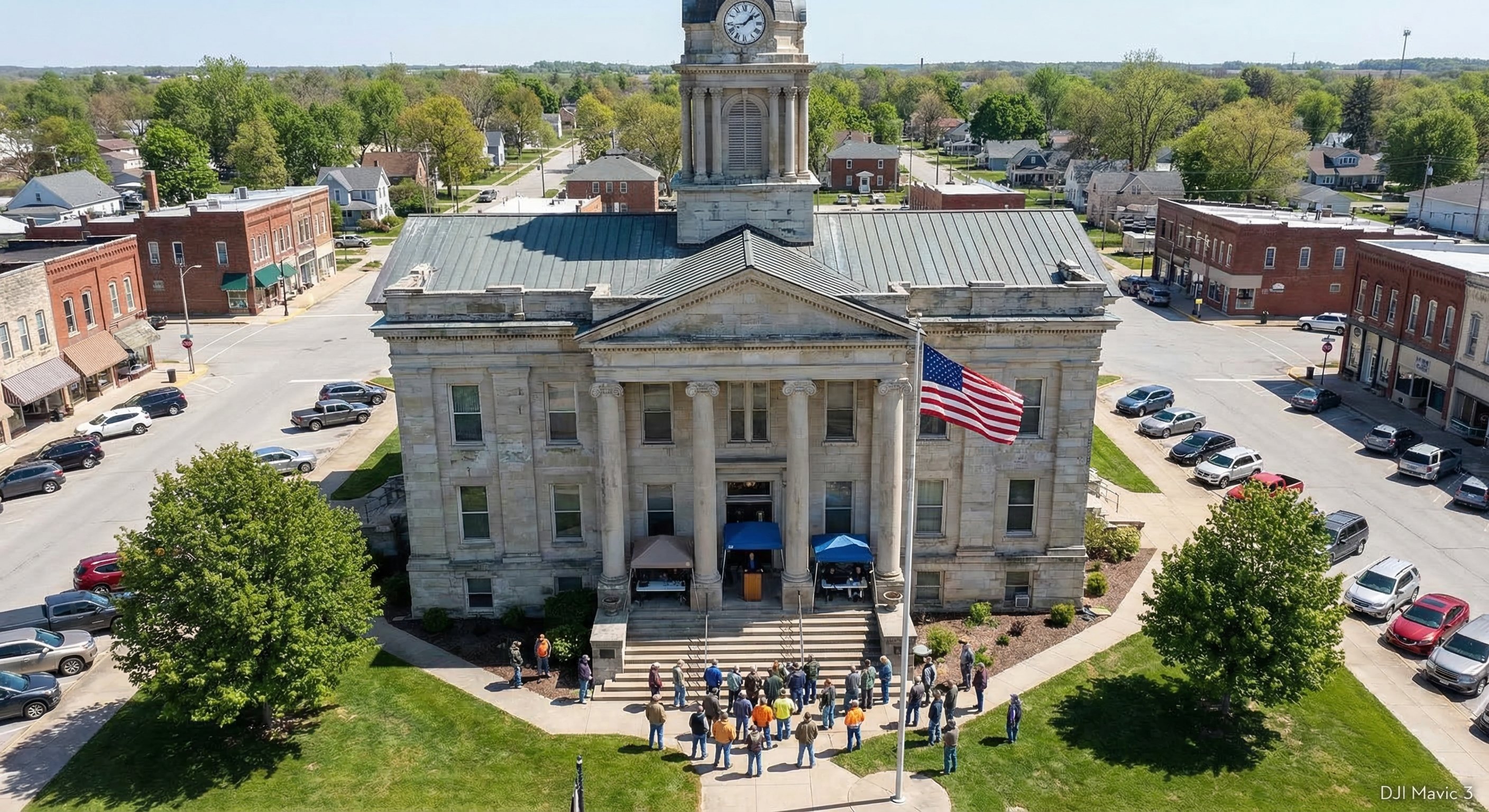 County courthouse with auction notices posted on public board