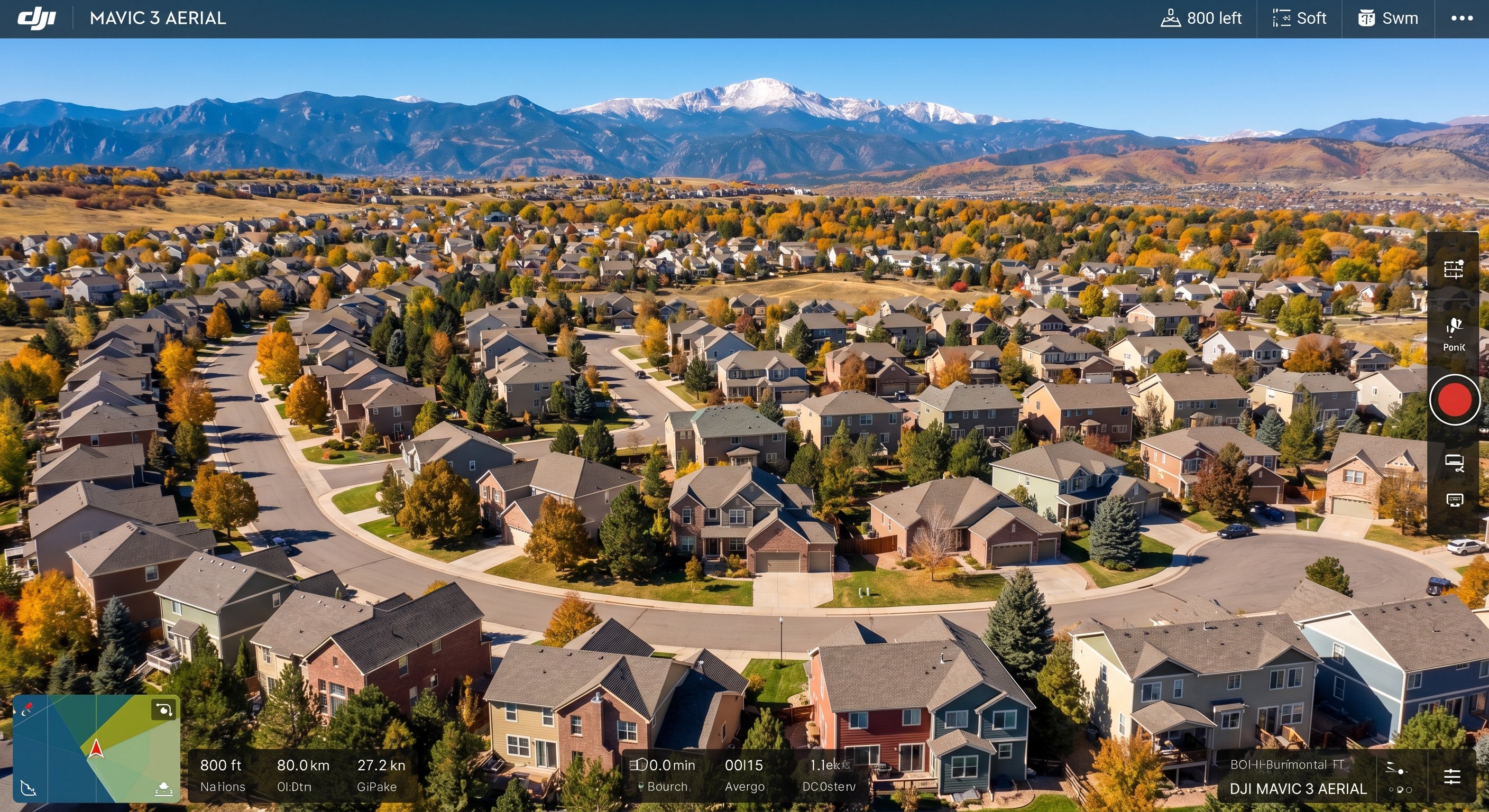 Aerial view of a Colorado neighborhood with mountain backdrop