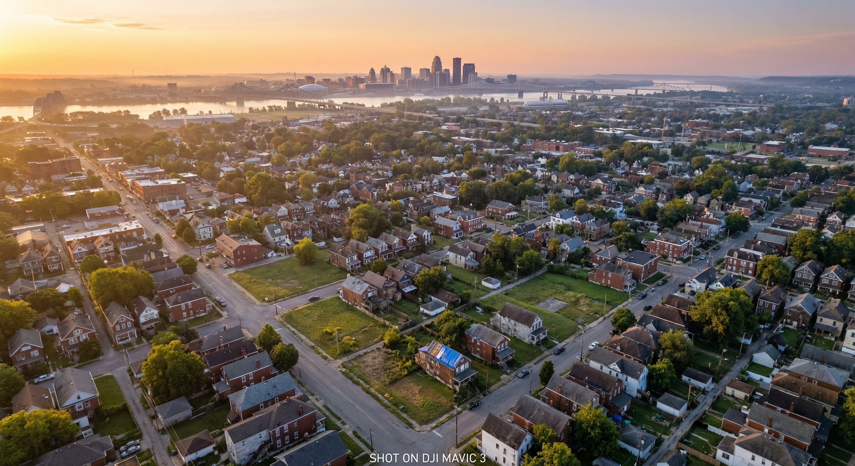 Aerial view of Jefferson County Louisville metropolitan area at sunrise with Ohio River and downtown skyline