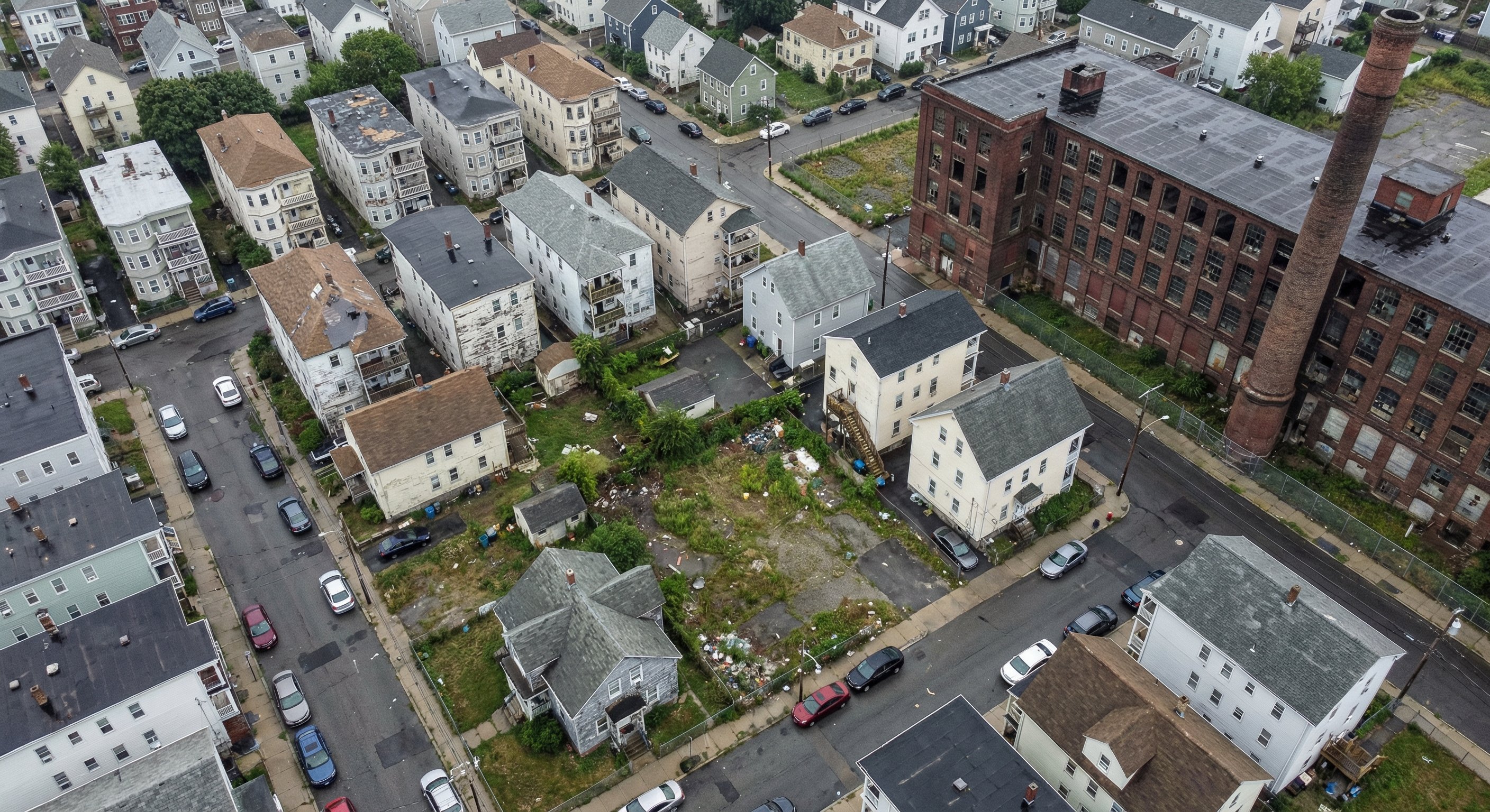 Aerial view of a Massachusetts post-industrial city showing vacant lots and distressed housing